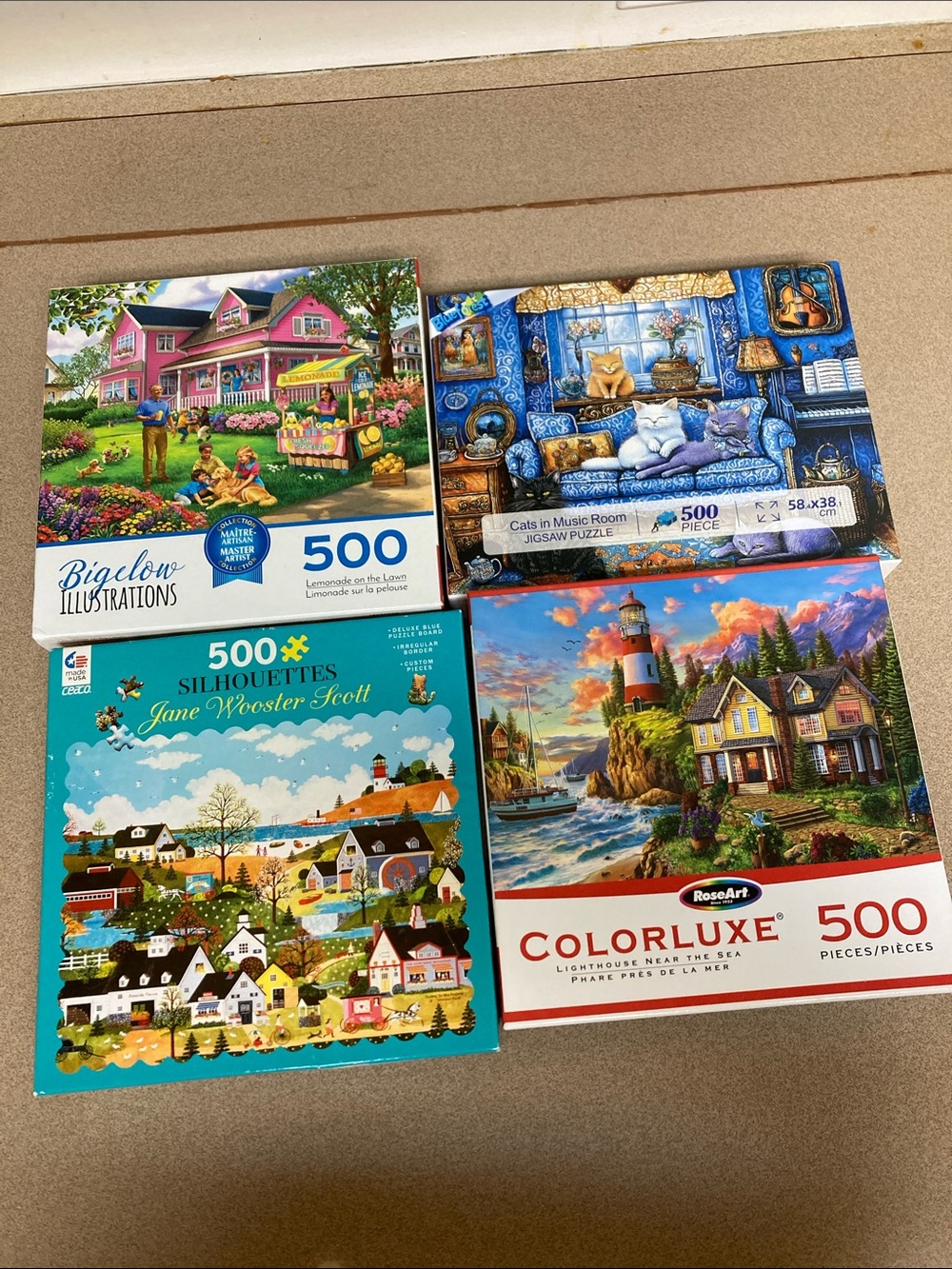 4 count Puzzle assortment including ColorLuxe 500-Piece Lighthouse Puzzle